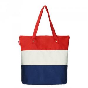 Canvas shopping bag with long carry handles and secure top button closure